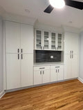 All-White Kitchen Cabinetry with Integrated Double Ovens & Gas Cooktop 