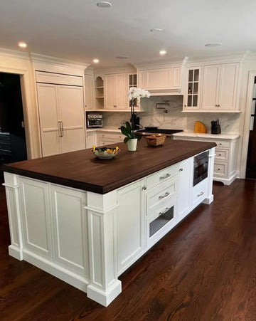 Classic White Inset Kitchen Cabinetry with Dark Wood Island Top