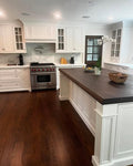 Classic White Inset Kitchen Cabinetry with Dark Wood Island Top