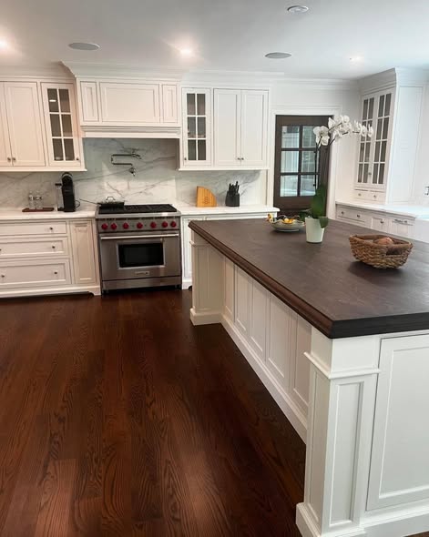 Classic White Inset Kitchen Cabinetry with Dark Wood Island Top