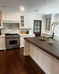 Classic White Inset Kitchen Cabinetry with Dark Wood Island Top