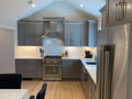 Contemporary Charcoal Gray Kitchen Cabinetry with White Quartz