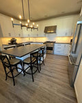 Contemporary Cream Kitchen Cabinetry with Black Island & amp.