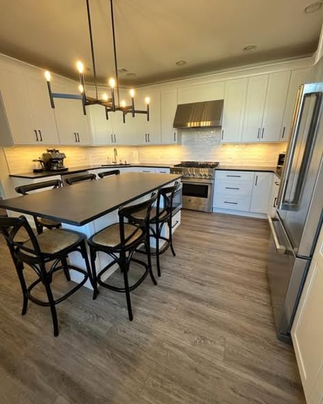 Contemporary Cream Kitchen Cabinetry with Black Island & amp.