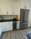 Contemporary Cream Kitchen Cabinetry with Black Island & amp.