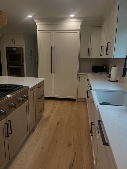 Contemporary Mixed-Tone Kitchen Cabinetry with Built-In Appliances