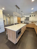 Mixed-Tone Kitchen Cabinetry with Built-In Appliances & Marble Counters