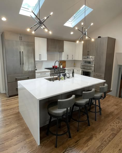 Modern Three-Tone Kitchen Cabinetry with Casual Bar Island