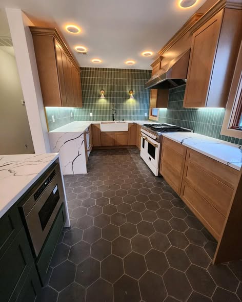 Warm Wood Kitchen Cabinetry with Green Backsplash &amp; Quartz Counters